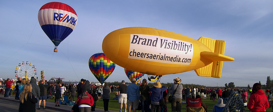 Amelia Airship with RE/MAX Balloon - Cheers Aerial Media